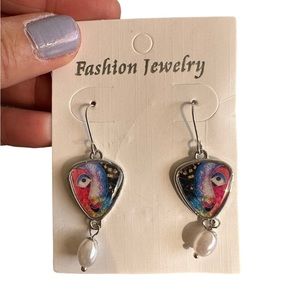 Abstract Face with Pearl Drop Earrings